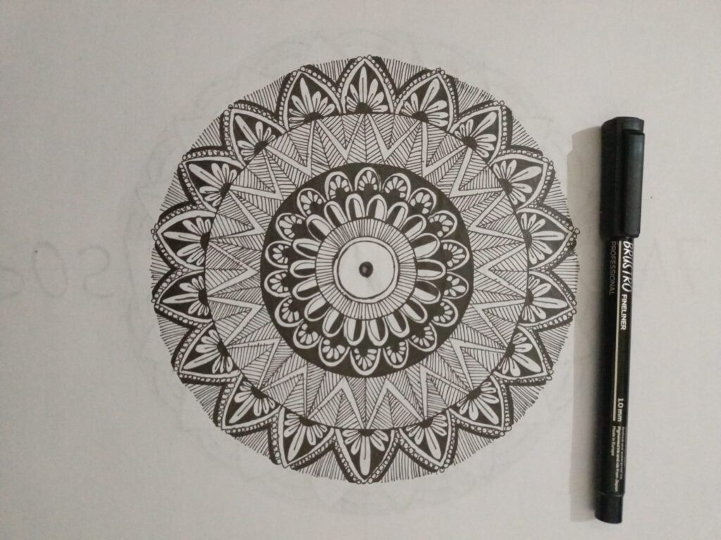 Hand-drawn circular design with a pen.